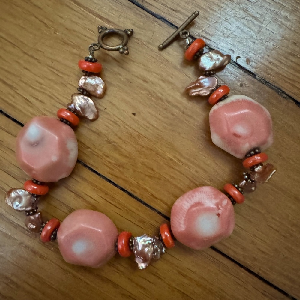 Hand strung coral, pearl, silver and copper bracelet